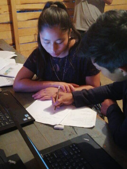 A girl working with a computer in Byron Cap's original internet cafe.