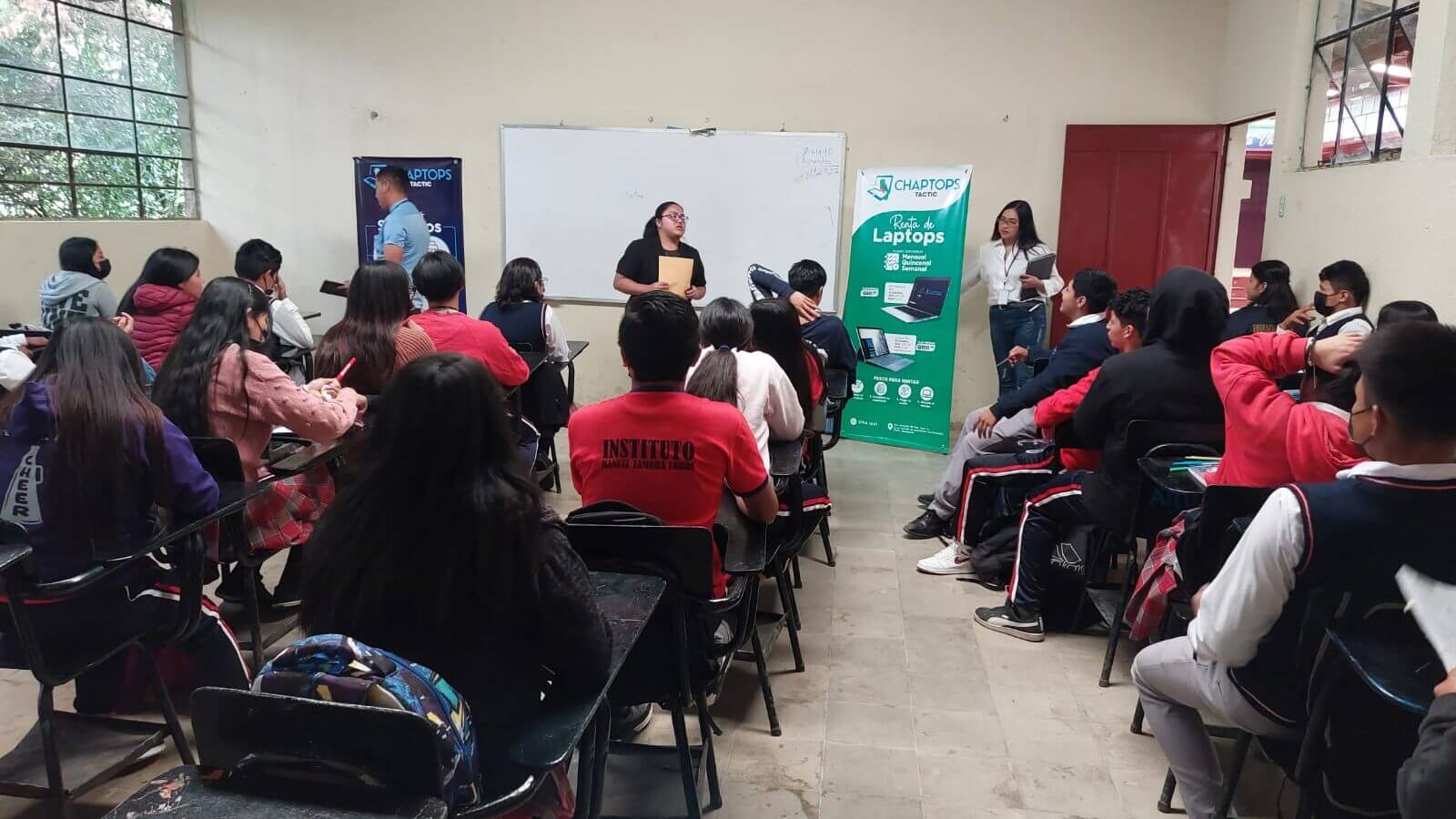 Chaptops volunteers Heidy Cap and Iris Xitimul presenting Chaptops services to a class at a school in Tactic, Alta Verapaz, Guatemala.